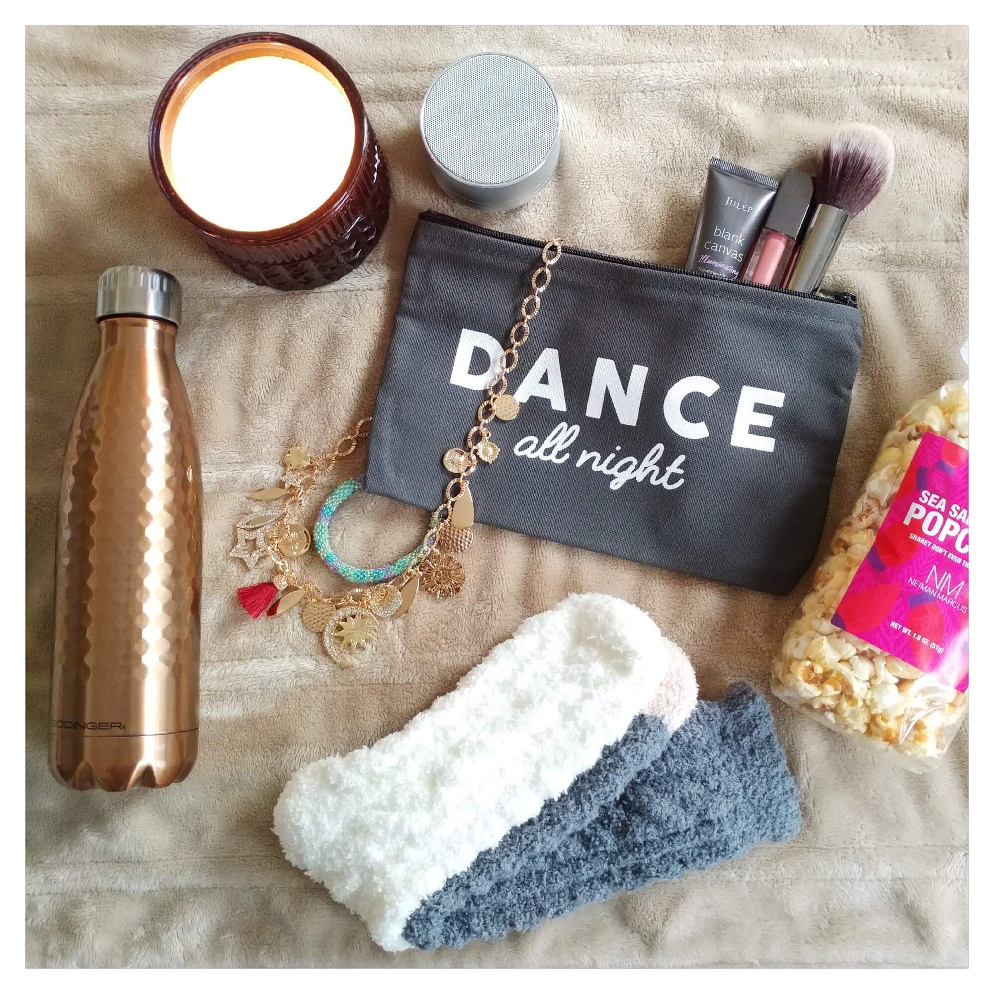 stay-warm-this-winter-cozy-socks-scented-candles-popcorn