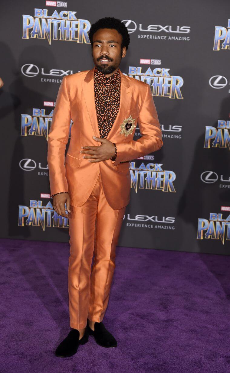 Donald Glover wears orange on Black Panther red carpet