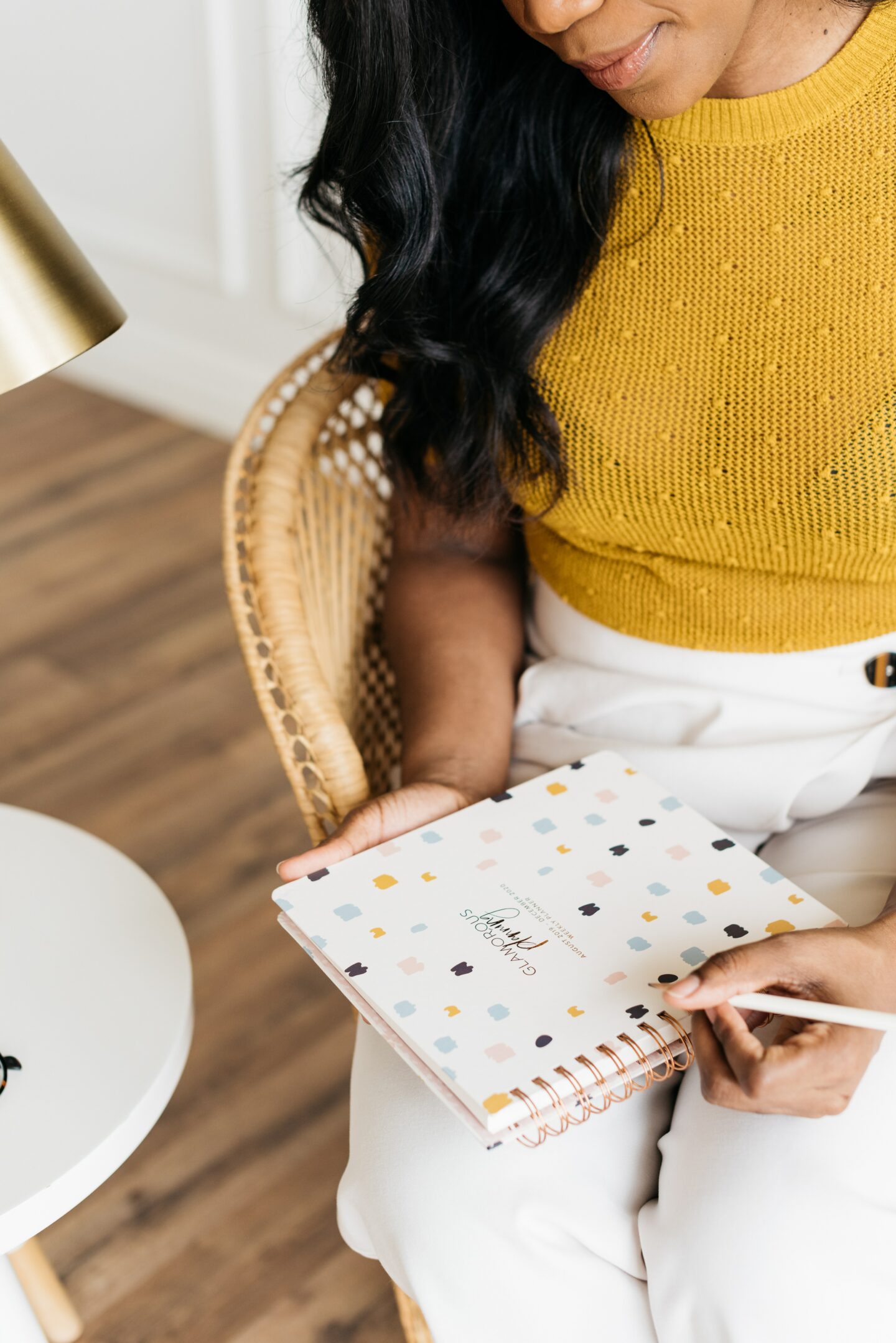 woman holding a planner and pen choosing new habits