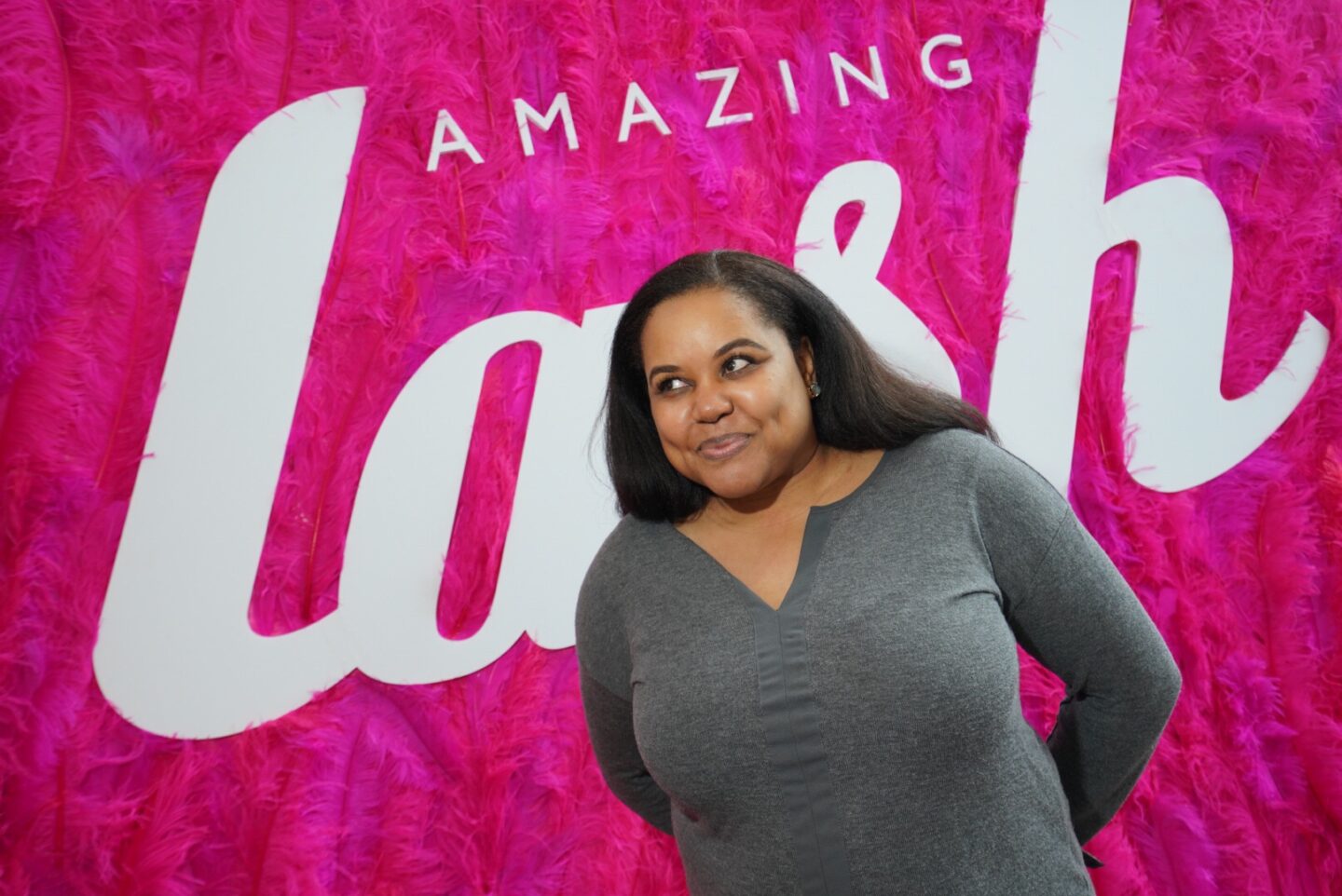 smiling woman shows off her long lashes