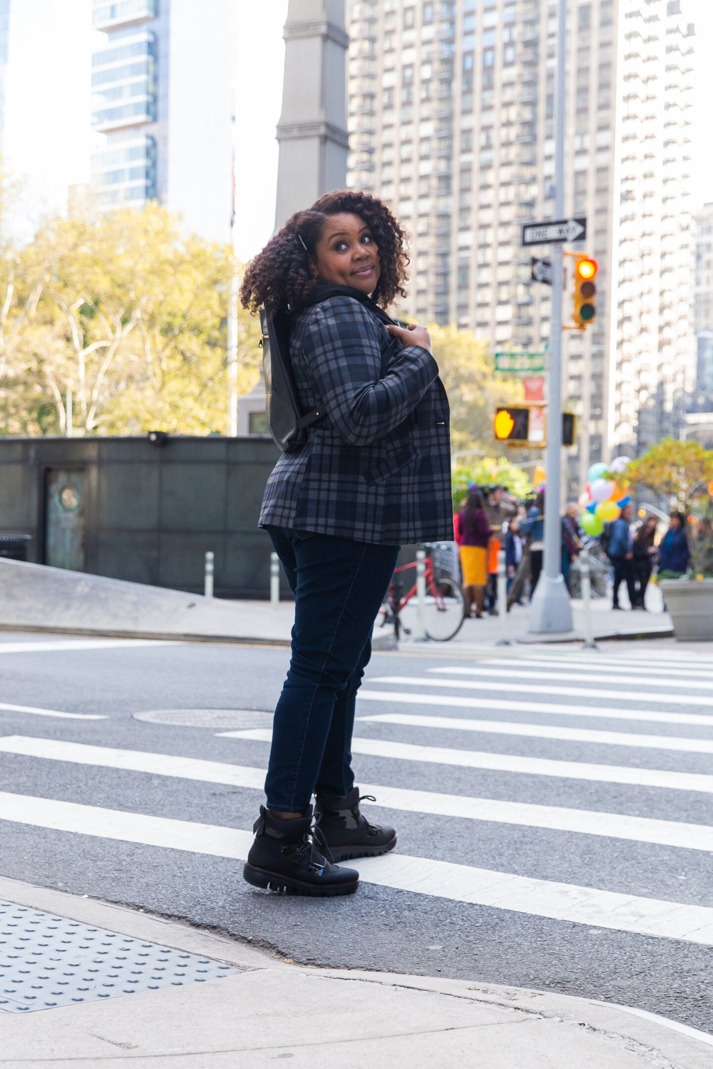 fall fashion uniform: Patranila wearing plaid jacket, blue jeans and black ankle boots