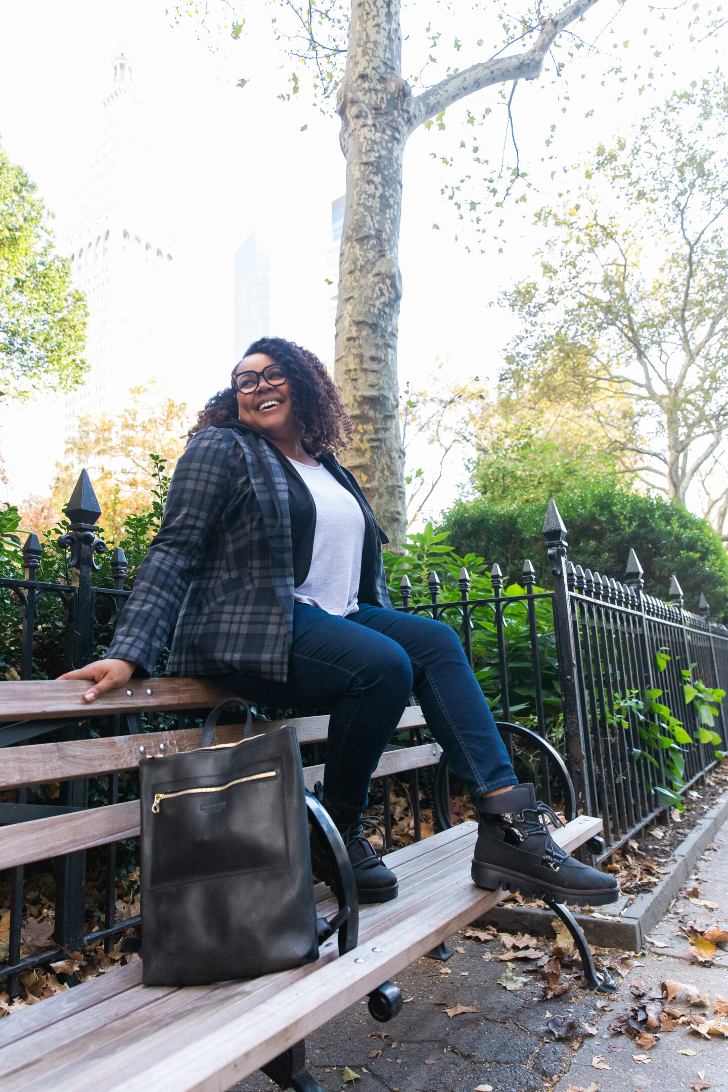 patranila sits on a bench in madison square park