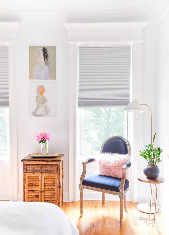 white bedroom blue chair pink pillow