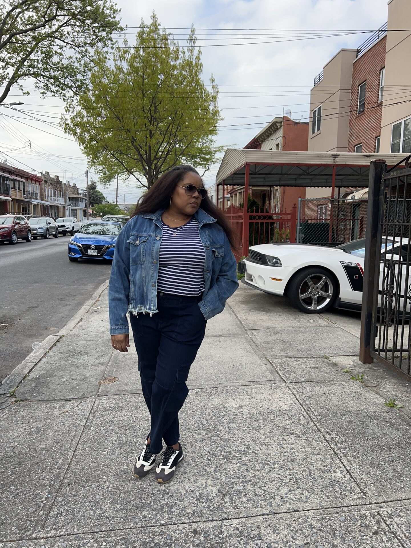 mental health in may. Patranila wears mixed denim and Tory Burch sneakers